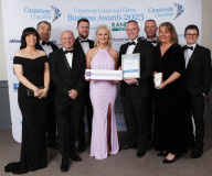 COMMUNITY IMPACT AWARD goes to Terex received by Mark McKay and  Darryl McGall  from Arlene McConaghie of sponsor RIADA RESOURCING at the Causeway Chamber of Commerce Awards 2023 in partnership with Randox Health held at the Lodge Hotel.     19 Chamber Awards 2023