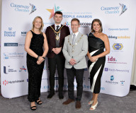 Chamber CEO Karen Yates with Mayor Ciaran McQuillan welcomed by Chamber President James Kilgore with the evenings compere Sarah Travers at the Causeway Chamber of Commerce CC&G People Awards 2024 in partnership with Go Succeed (NI Business Support) held at the Lodge Hotel.     03 Chamber Awards Formal pics