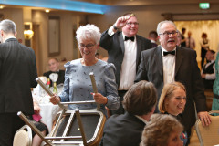 Finding the star prizes under their seats during the charity auction for Zomba at the Annual President's Dinner held in the Lodge Hotel.     46 Causeway