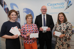 Sinead Lynch from nominated charity Chest Heart and Stroke with the winners of the prize draw at the end of the President's Lunch held at the Lodge Hotel, Coleraine.     44 Presidents Lunch